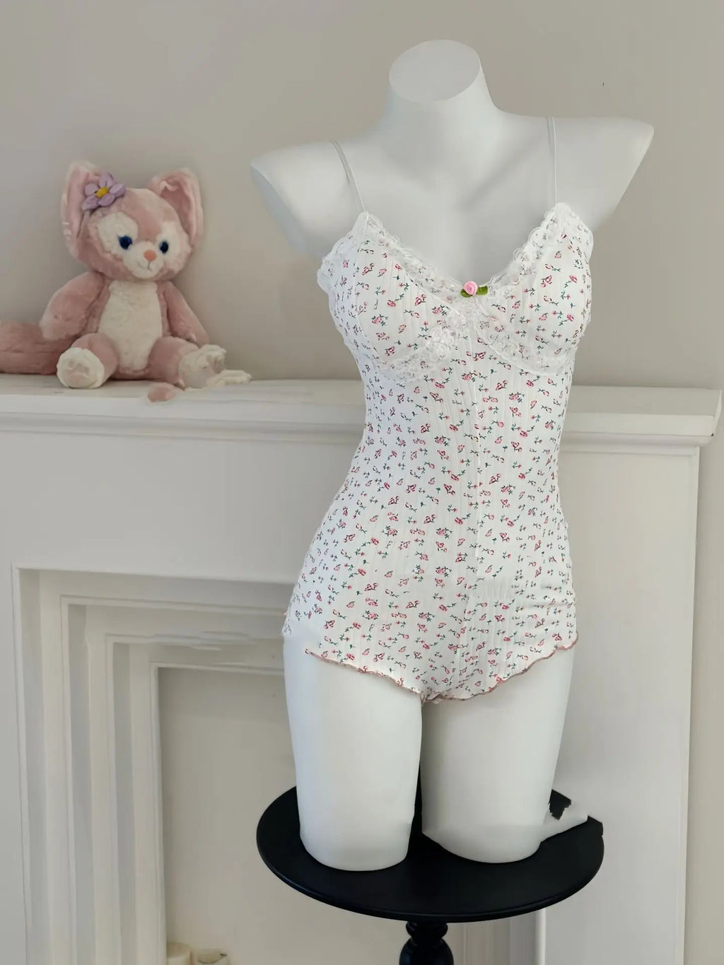 FloraLace Bodysuit – Floral Print Sleeveless Fit  Soft lace. Floral charm. Effortless allure.