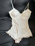 FloraLace Bodysuit – Floral Print Sleeveless Fit  Soft lace. Floral charm. Effortless allure.