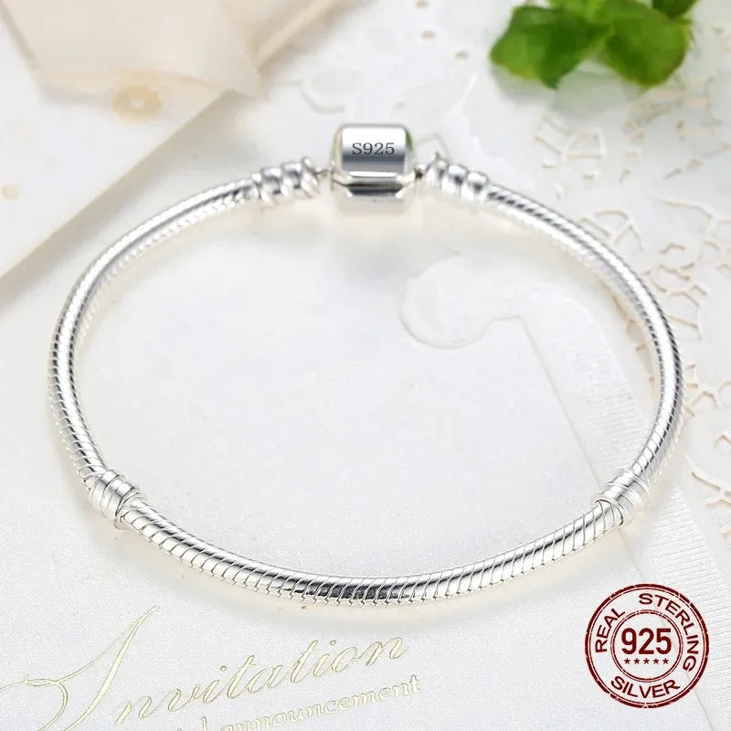 Silver Serpent Charm Bracelet – 925 Sterling Silver  Pure silver. Smooth feel. Timeless elegance.