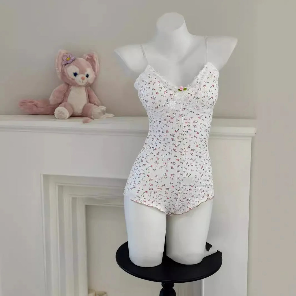 FloraLace Bodysuit – Floral Print Sleeveless Fit  Soft lace. Floral charm. Effortless allure.