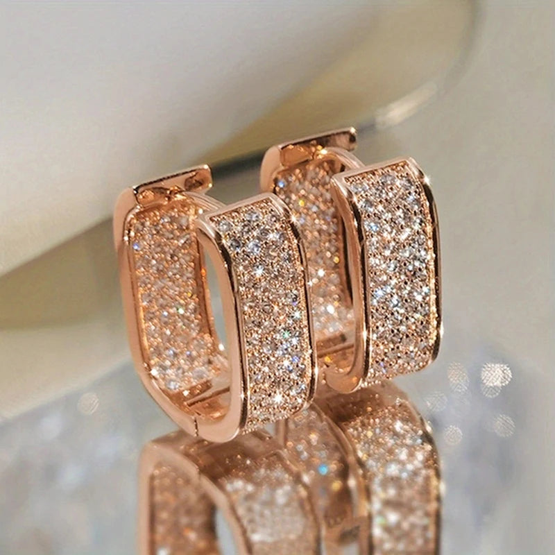 Bling Aura Hoops – CZ Luxury Statement Earrings  Maximum shine. Minimal effort. Pure elegance.