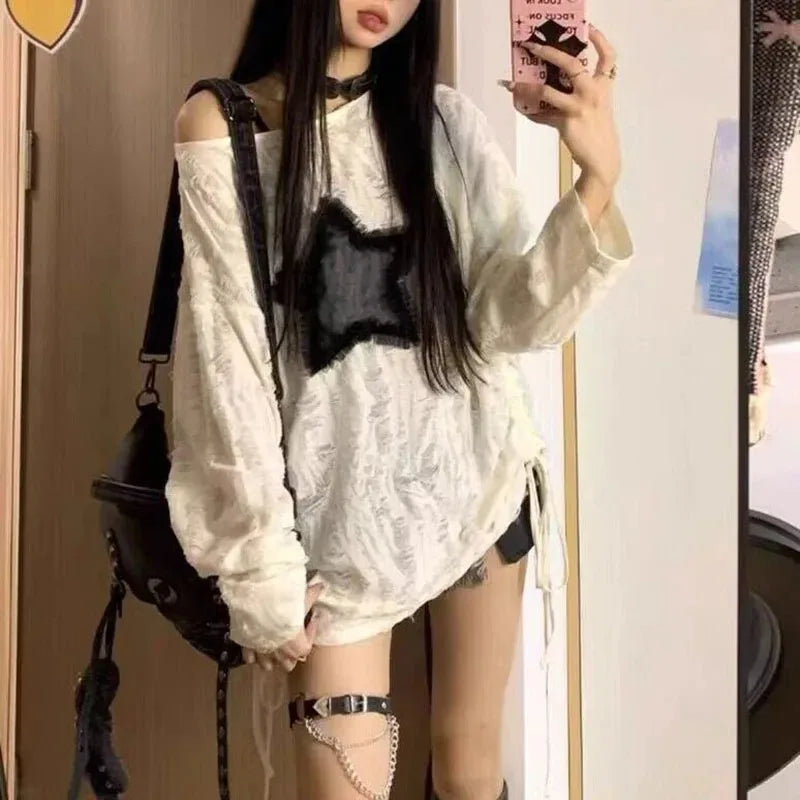 StarEdge Oversized Tee – Y2K Hole Print Streetwear  Bold details. K-pop vibes. Effortless attitude.