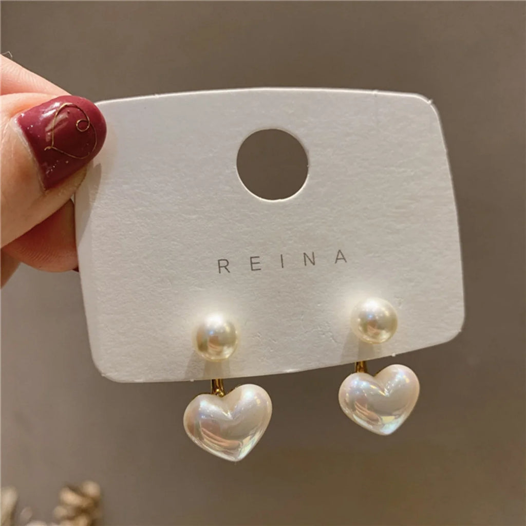 Love Pearl Earrings – Minimalist Heart Elegance  Simple love. Soft shine. Timeless beauty.
