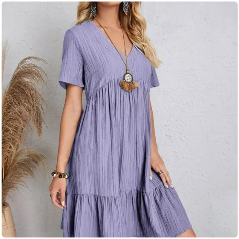 FlareMuse Peplum Dress – V-Neck Ruffle Summer Style  Soft flow. Flattering shape. Effortless charm.