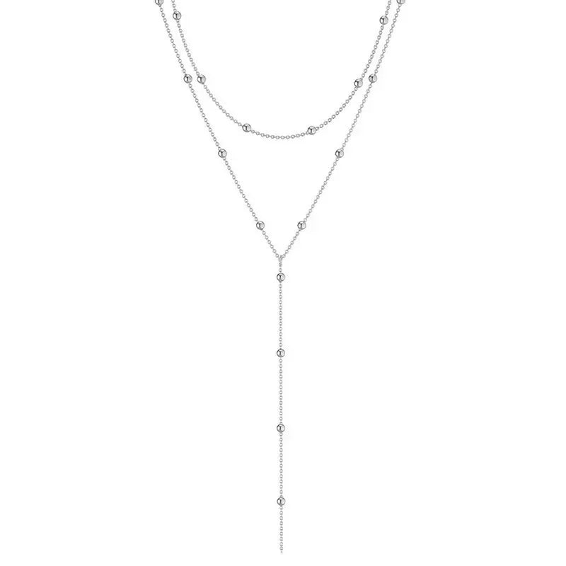 LuxeTassel Necklace – Double Layer Chain Choker  Layered shine. Flowing detail. Effortless elegance.