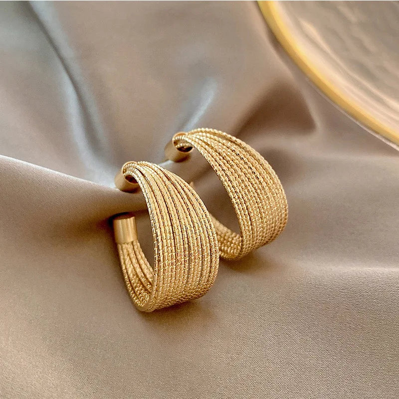 AquaDrop Earrings – 18K Gold Plated Elegance  Fluid shape. Golden shine. Everyday luxury.