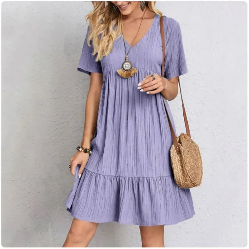 FlareMuse Peplum Dress – V-Neck Ruffle Summer Style  Soft flow. Flattering shape. Effortless charm.